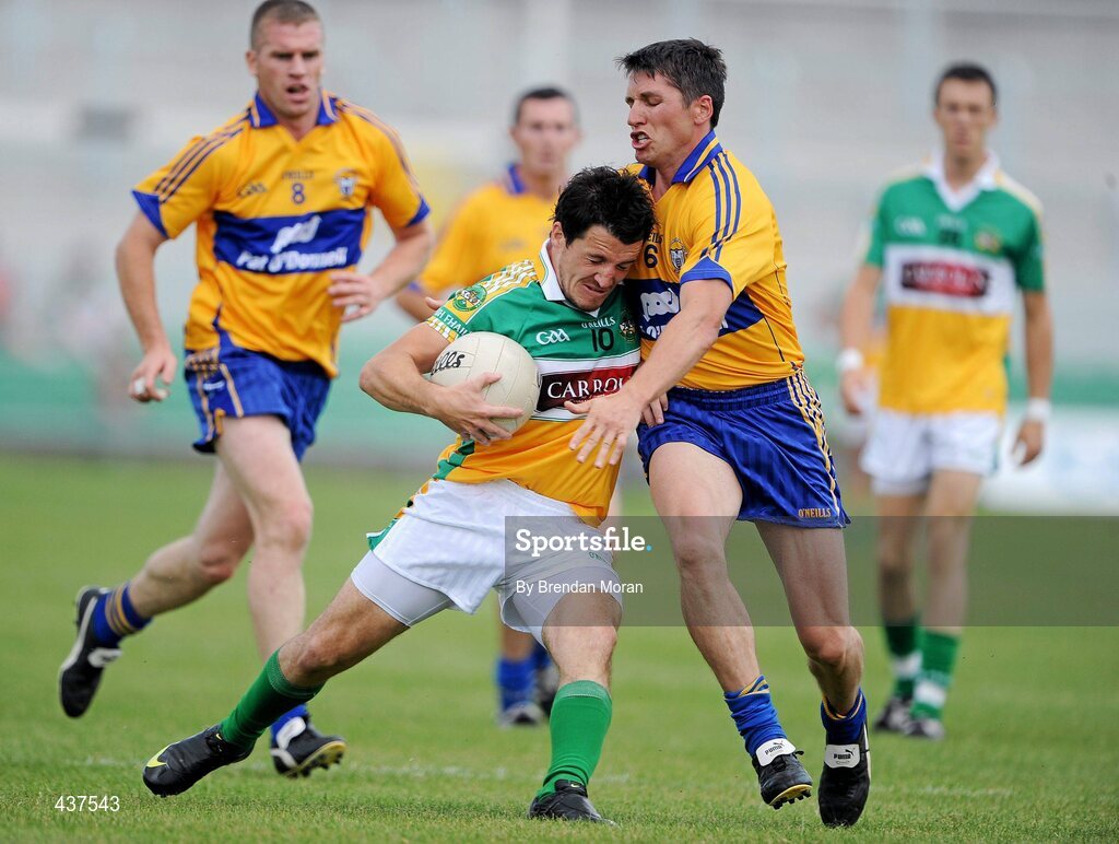 26 June 2010; John Reynolds, Offaly, is defended by Gordon Kelly, Clare. GAA Football All-Ireland Senior Championship Qualifier Round 1, Offaly v Clare, O'Connor Park, Tullamore, Co. Offaly. Picture credit: Brendan Moran / SPORTSFILE