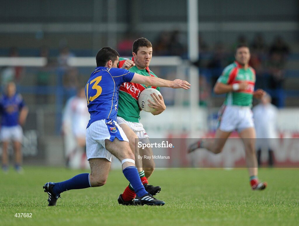 26 June 2010; Chris Barrett, Mayo, in action against Francis McGee, Longford. GAA Football All-Ireland Senior Championship Qualifier Round 1, Longford v Mayo, Pearse Park, Longford. Picture credit: Ray McManus / SPORTSFILE