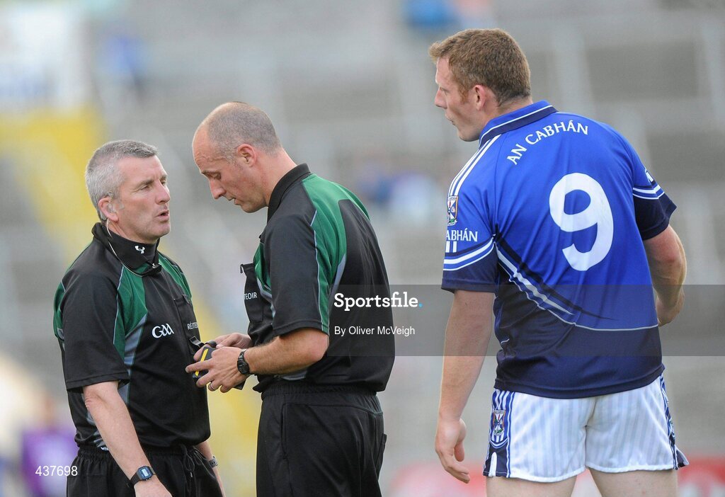 26 June 2010; Referee Cormac Reilly, right, consults with linesman Jimmy McKee before sending Cavan's Lorcan Mulvey, 9, off for a straight red card. GAA Football All-Ireland Senior Championship Qualifier Round 1, Cavan v Wicklow, Kingspan Breffni Park, Cavan. Picture credit: Oliver McVeigh / SPORTSFILE