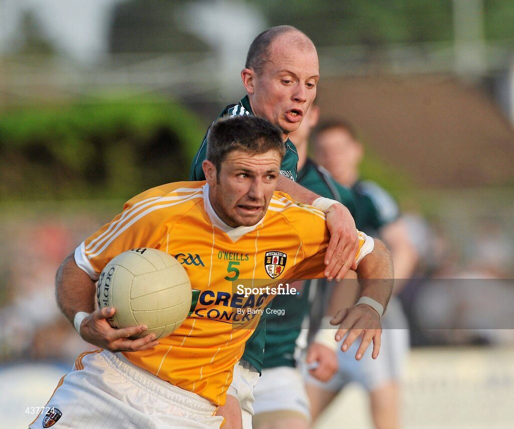 26 June 2010; Tony Scullion, Antrim, in action against James Kavanagh, Kildare. GAA Football All-Ireland Senior Championship Qualifier Round 1, Kildare v Antrim, St Conleth's Park, Newbridge, Co. Kildare. Picture credit: Barry Cregg / SPORTSFILE
