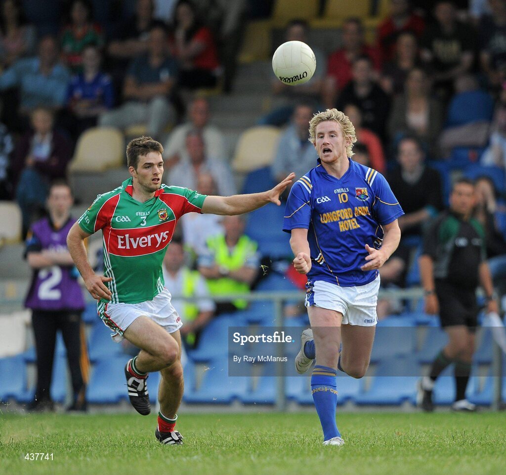 26 June 2010; Paddy Dowd, Longford, in action against Ger Cafferkey, Mayo. GAA Football All-Ireland Senior Championship Qualifier Round 1, Longford v Mayo, Pearse Park, Longford. Picture credit: Ray McManus / SPORTSFILE
