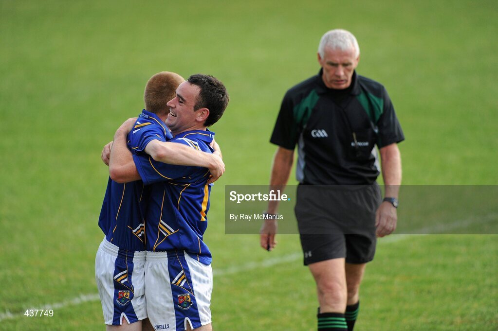 26 June 2010; Longford players Seamus Hannon, left, and Diarmuid Masterson celebrate as referee Gearoid O Conamhna leaves the field.  GAA Football All-Ireland Senior Championship Qualifier Round 1, Longford v Mayo, Pearse Park, Longford. Picture credit: Ray McManus / SPORTSFILE