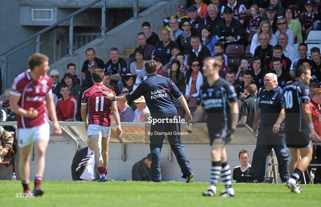 27 June 2010; Sean Armstrong, Galway, 11, gets a pat on the back from selector Sean O Domhnaill after being shown a second yellow card and subsequently being sent off by referee David Coldrick. Connacht GAA Football Senior Championship Semi-Final, Galway v Sligo, Pearse Stadium, Galway. Picture credit: Diarmuid Greene / SPORTSFILE