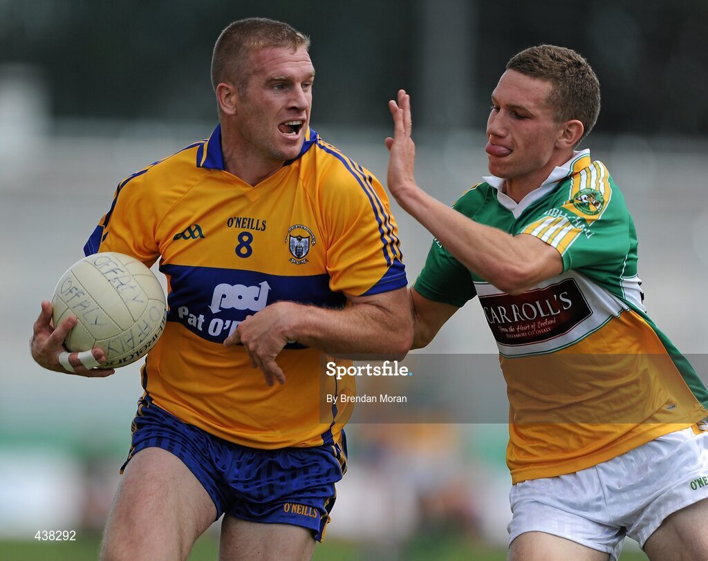 26 June 2010; Ger Quinlan, Clare, in action against Anton Sullivan, Offaly. GAA Football All-Ireland Senior Championship Qualifier Round 1, Offaly v Clare, O'Connor Park, Tullamore, Co. Offaly. Picture credit: Brendan Moran / SPORTSFILE