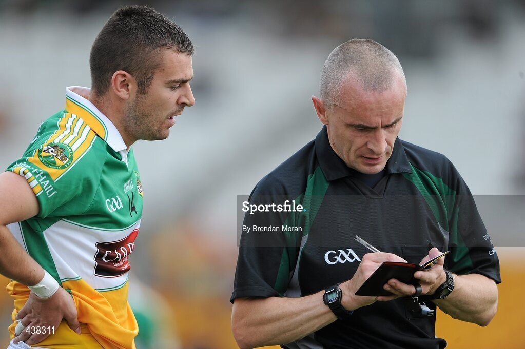26 June 2010; Referee Martin Higgins takes the name of Ken Casey, Offaly. GAA Football All-Ireland Senior Championship Qualifier Round 1, Offaly v Clare, O'Connor Park, Tullamore, Co. Offaly. Picture credit: Brendan Moran / SPORTSFILE