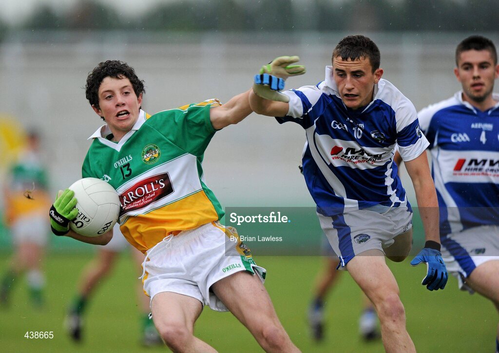 30 June 2010; Paul McPadden, Offaly, in action against Shane McCauley and Ruairi Dunne, right, Laois. ESB Leinster GAA Football Minor Championship Semi-Final, Offaly v Laois, O'Connor Park, Tullamore, Co. Offaly. Picture credit: Brian Lawless / SPORTSFILE