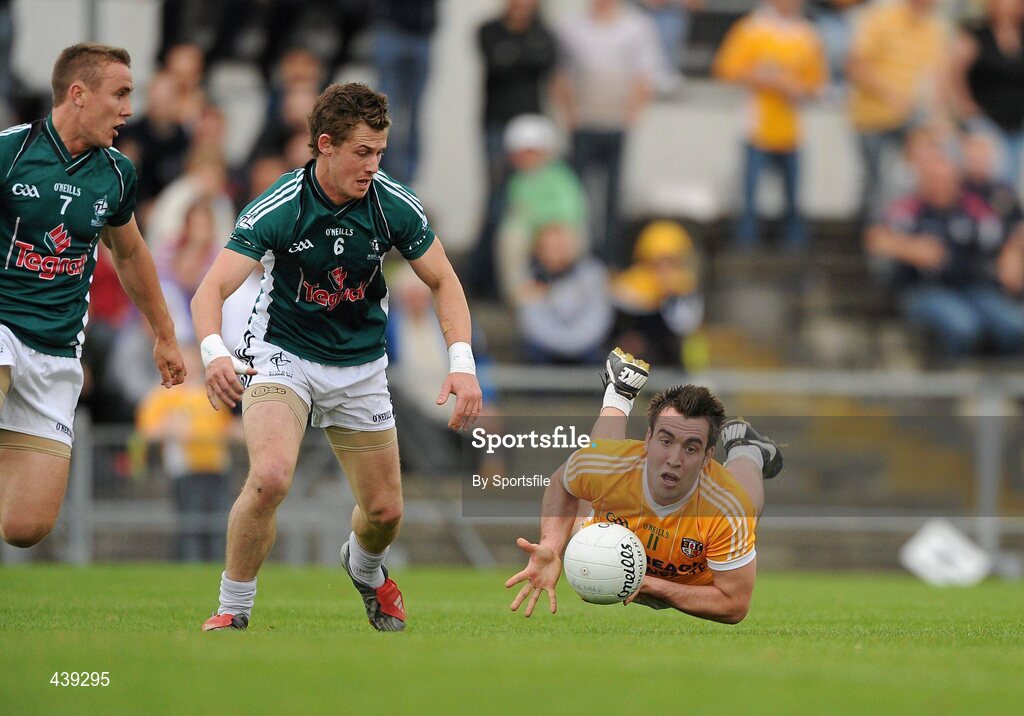3 July 2010; Kevin Niblock, Antrim, in action against Brian Flanagan, left, and Emmet Bolton, Kildare. GAA Football All-Ireland Senior Championship Qualifier Round 1 Replay, Antrim v Kildare, Casement Park, Belfast, Co. Antrim. Photo by Sportsfile