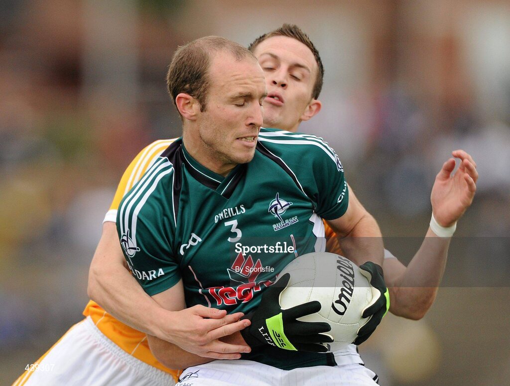 3 July 2010; Hugh McGrillen, Kildare, in action against Michael McCann, Antrim. GAA Football All-Ireland Senior Championship Qualifier Round 1 Replay, Antrim v Kildare, Casement Park, Belfast, Co. Antrim. Photo by Sportsfile