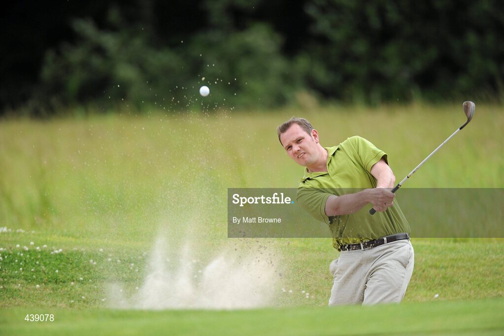 2 July 2010; Tiernan Byrne, from St. Particks GAA Club, Dublin, plays from the bunker onto the 1st green during the FBD All-Ireland GAA Golf Challenge 2010 Leinster Final. Palmerstown House Golf Club, Co. Kildare. Picture credit: Matt Browne / SPORTSFILE