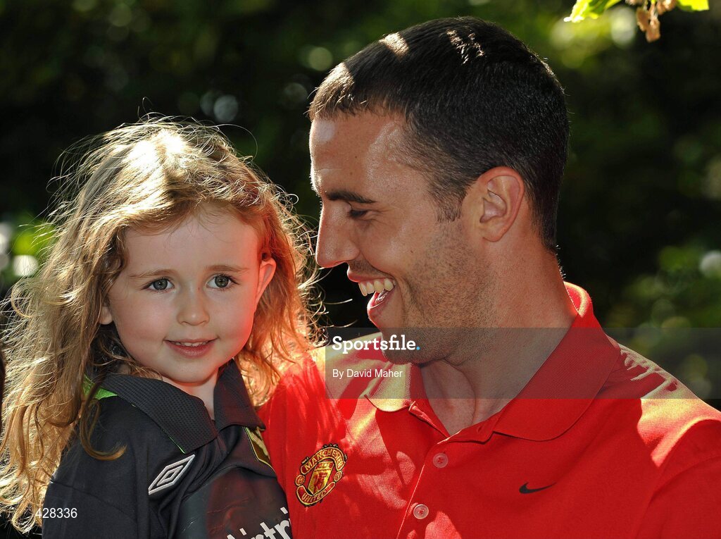 8 July 2010; Manchester United and Republic of Ireland International John O'Shea with Sophie Cooke, age 4, from Bray, Co. Wicklow, pictured at the ticket launch for the Airtricity Challenge on Wednesday August 4th when a representative Airtricity League XI takes on Manchester United at the Aviva Stadium. The Airtricity Challenge will be the first historic match in the new stadium. Portmarnock Hotel and Golf Links, Portmarnock, Co. Dublin. Picture credit: David Maher / SPORTSFILE