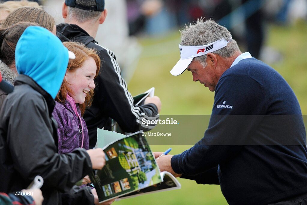 6 July 2010; Darren Clarke autographs a programme for Orla Shanahan from Newcastlewest, Co. Limerick, during the JP McManus Invitational Pro-Am. Adare Manor, Co. Limerick. Picture credit: Matt Browne / SPORTSFILE
