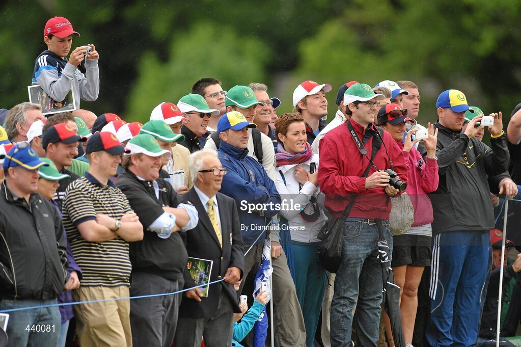 6 July 2010; Spectators watch on as Tiger Woods putts on the 7th green during the JP McManus Invitational Pro-Am. Adare Manor, Adare, Co. Limerick. Picture credit: Diarmuid Greene / SPORTSFILE