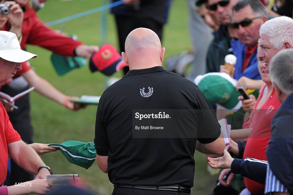 6 July 2010; Former Ireland rugby captain Keith Wood signs autograph on his way to the 16th tee box during the JP McManus Invitational Pro-Am. Adare Manor, Co. Limerick. Picture credit: Matt Browne / SPORTSFILE