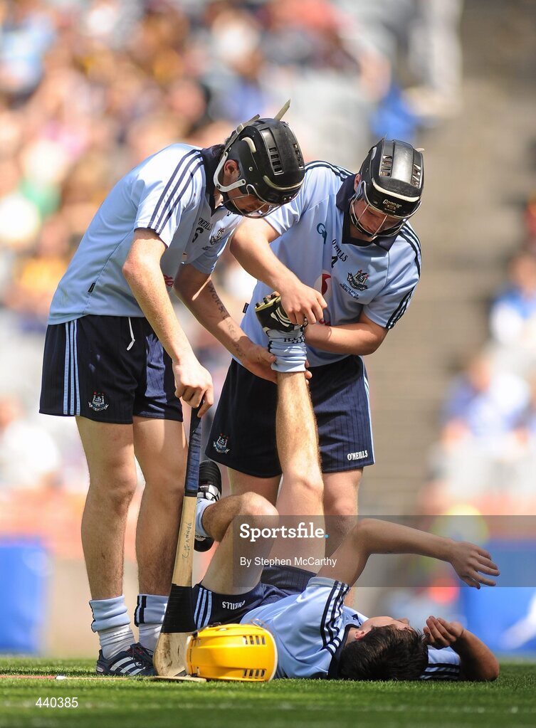 4 July 2010; Conor Murphy, Dublin, is helped with his injury by team-mates Danny Sutcliffe, left, and Sean McClelland. ESB Leinster GAA Hurling Minor Championship Final, Dublin v Kilkenny, Croke Park, Dublin. Picture credit: Stephen McCarthy / SPORTSFILE