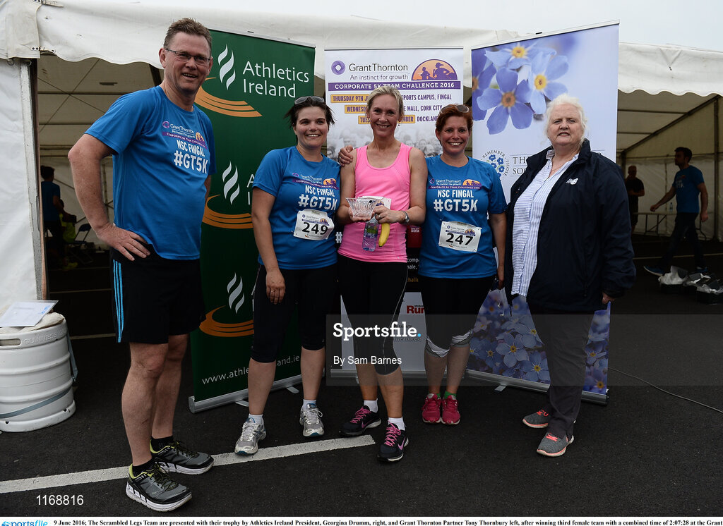 9 June 2016; The Scrambled Legs Team are presented with their trophy by Athletics Ireland President, Georgina Drumm, right, and Grant Thornton Partner Tony Thornbury left, after winning third female team with a combined time of 2:07:28 at the Grant Thornton Corporate 5K Team Challenge at the National Sports Campus in Abbotstown, Dublin. Photo by Sam Barnes/Sportsfile