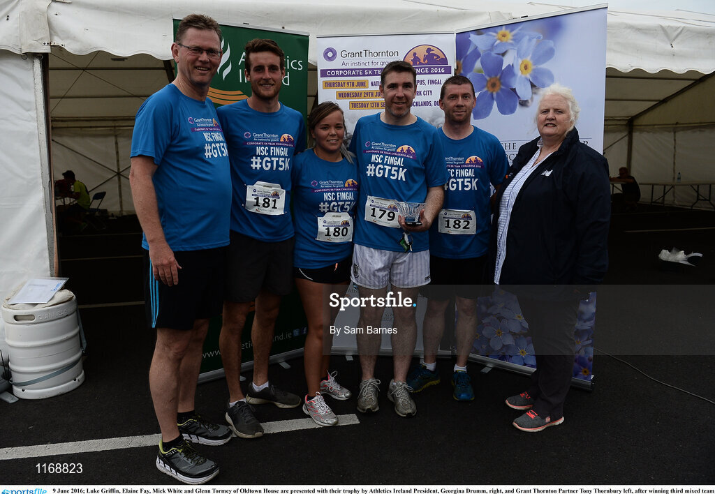 9 June 2016; Luke Griffin, Elaine Fay, Mick White and Glenn Tormey of Oldtown House are presented with their trophy by Athletics Ireland President, Georgina Drumm, right, and Grant Thornton Partner Tony Thornbury left, after winning third mixed team with a combined time of 1:36:43 at the Grant Thornton Corporate 5K Team Challenge at the National Sports Campus in Abbotstown, Dublin. Photo by Sam Barnes/Sportsfile