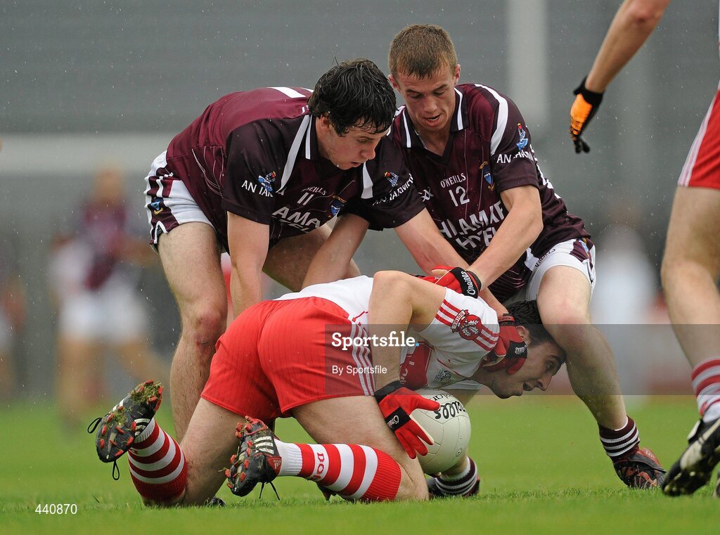 10 July 2010; Kevin McGuckin, Derry, in action against Conor Lynam, left, and Ger Egan, Westmeath. GAA Football All-Ireland Senior Championship Qualifier, Round 2, Westmeath v Derry, Cusack Park, Mullingar, Co. Westmeath. Photo by Sportsfile