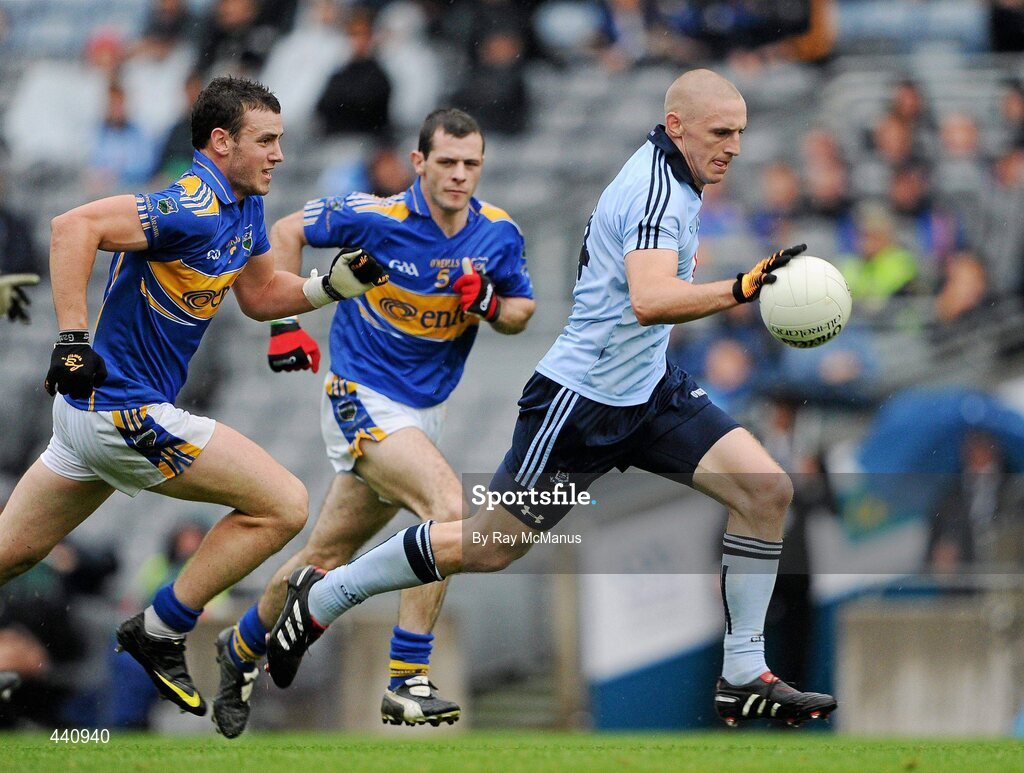 10 July 2010; Eoghan O'Gara, Dublin, in action against Ciaran McGrath, 5, and Paddy Codd, Tipperary. GAA Football All-Ireland Senior Championship Qualifier, Round 2, Dublin v Tipperary, Croke Park, Dublin. Picture credit: Ray McManus / SPORTSFILE