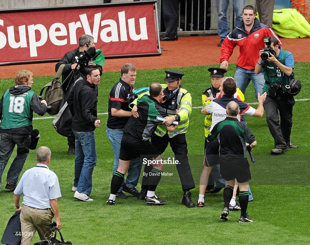11 July 2010; Members of An Garda Síochána step in as spectators approach referee Martin Sludden at the end of the game. Leinster GAA Football Senior Championship Final, Meath v Louth, Croke Park, Dublin. Picture credit: David Maher / SPORTSFILE