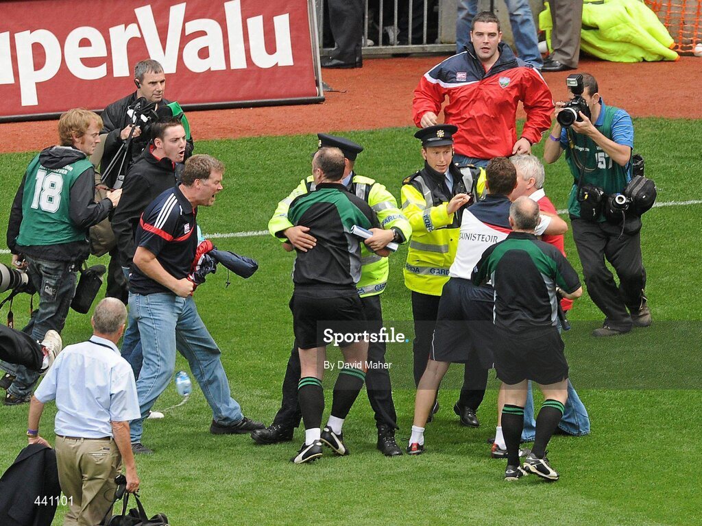11 July 2010; Members of An Garda Síochána step in as spectators approach referee Martin Sludden at the end of the game. Leinster GAA Football Senior Championship Final, Meath v Louth, Croke Park, Dublin. Picture credit: David Maher / SPORTSFILE