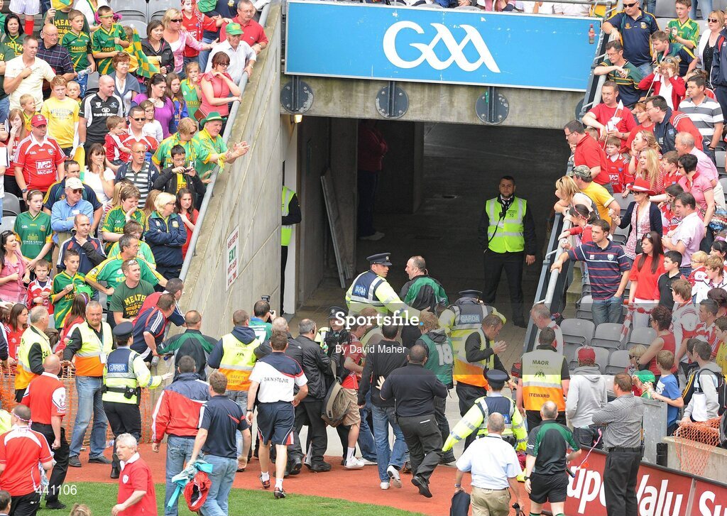 11 July 2010; Members of An Garda Síochána step in as spectators confront referee Martin Sludden, as he is led down the tunnel at the end of the game. Leinster GAA Football Senior Championship Final, Meath v Louth, Croke Park, Dublin. Picture credit: David Maher / SPORTSFILE