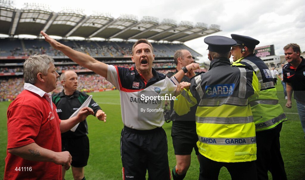 11 July 2010; Louth manager Peter Fitzpatrick appeals for fans to stay off the pitch as referee Martin Sludden is escorted off the field by Gardai. Leinster GAA Football Senior Championship Final, Meath v Louth, Croke Park, Dublin. Photo by Sportsfile
