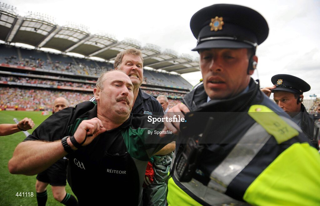 11 July 2010; Referee Martin Sludden is escorted off the field by Gardai. Leinster GAA Football Senior Championship Final, Meath v Louth, Croke Park, Dublin. Photo by Sportsfile