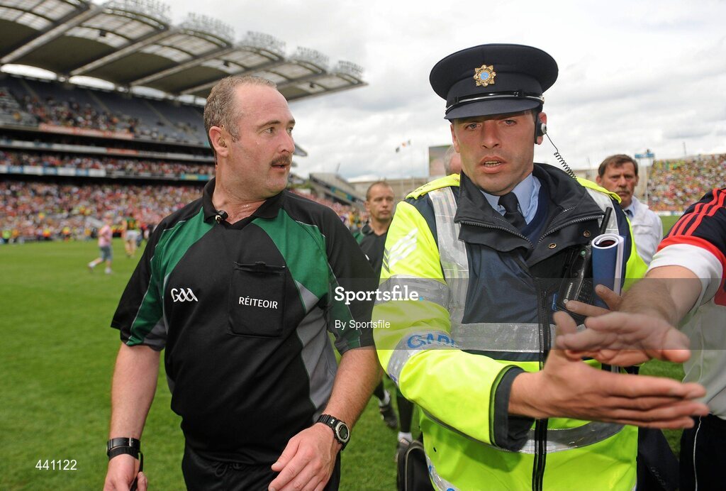 11 July 2010; Referee Martin Sludden is escorted off the field by Gardai. Leinster GAA Football Senior Championship Final, Meath v Louth, Croke Park, Dublin. Photo by Sportsfile