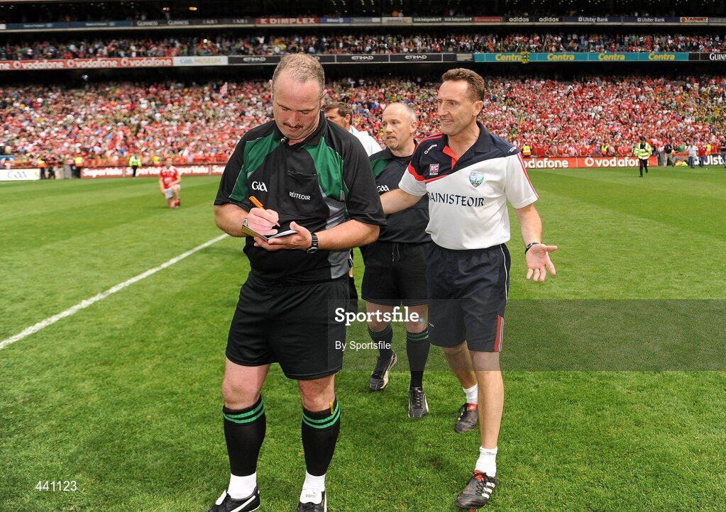 11 July 2010; Louth manager Peter Fitzpatrick speaks with referee Martin Sludden after the game. Leinster GAA Football Senior Championship Final, Meath v Louth, Croke Park, Dublin. Photo by Sportsfile