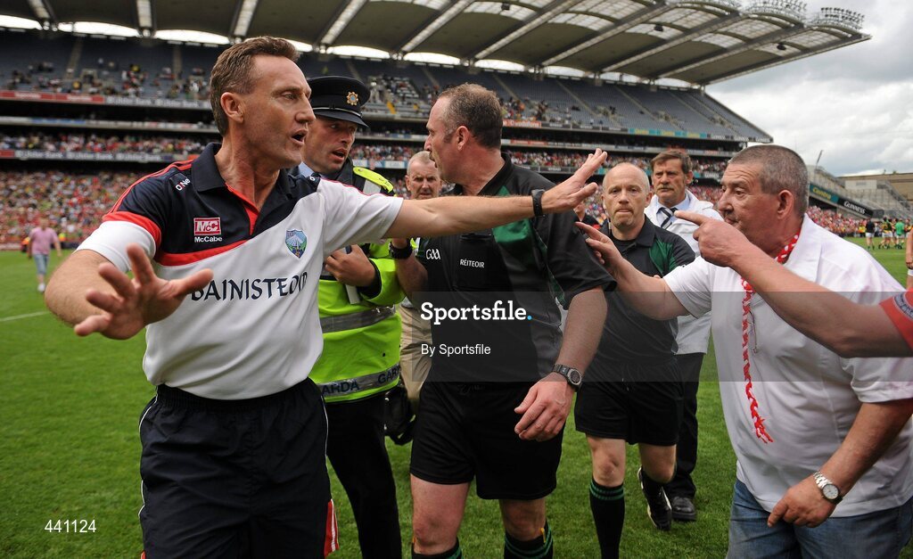 11 July 2010; Louth manager Peter Fitzpatrick appeals for fans to stay away from referee Martin Sludden as he is escorted off the field by Gardai. Leinster GAA Football Senior Championship Final, Meath v Louth, Croke Park, Dublin. Photo by Sportsfile