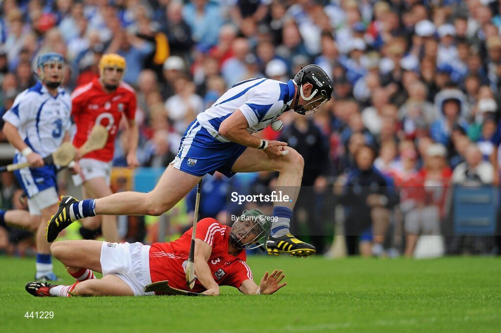 11 July 2010; Kevin Moran, Waterford, is tripped by  Eoin Cadogan, Cork. Munster GAA Hurling Senior Championship Final, Cork v Waterford, Semple Stadium, Thurles, Co. Tipperary. Picture credit: Barry Cregg / SPORTSFILE