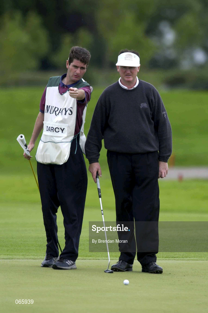 28 June 2001; Eamonn Darcy of Ireland sizes up a putt, with the help from his caddy, on the 8th green, during day one of the Murphy's Irish Open at Fota Island Golf Club in Cork. Photo by Brendan Moran/Sportsfile
