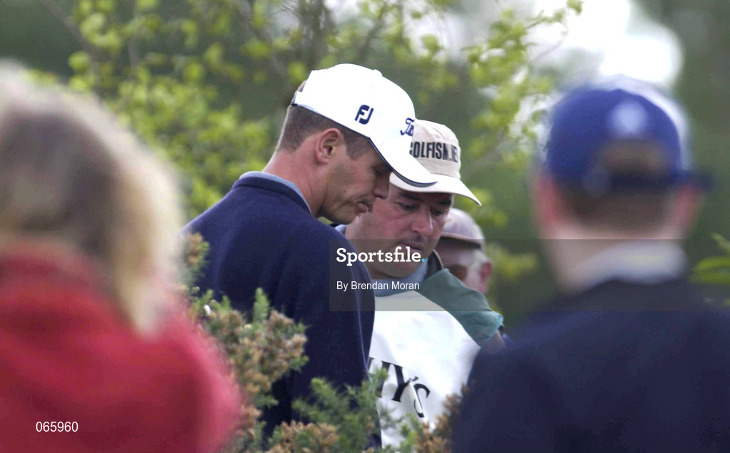 29 June 2001; Andrew Colthart of Scotland discusses his options with his caddy after his tee shot at the 16th lands in shrubs by the fairway during day two of the Murphy's Irish Open at Fota Island Golf Club in Cork. Photo by Brendan Moran/Sportsfile