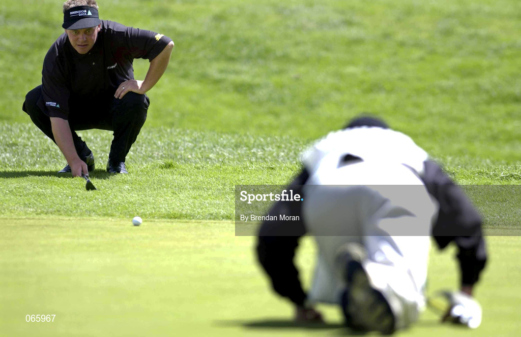 29 June 2001; Darren Clarke of Ireland lines up his putt on the 5th green with the help of his caddy during day two of the Murphy's Irish Open at Fota Island Golf Club in Cork. Photo by Brendan Moran/Sportsfile