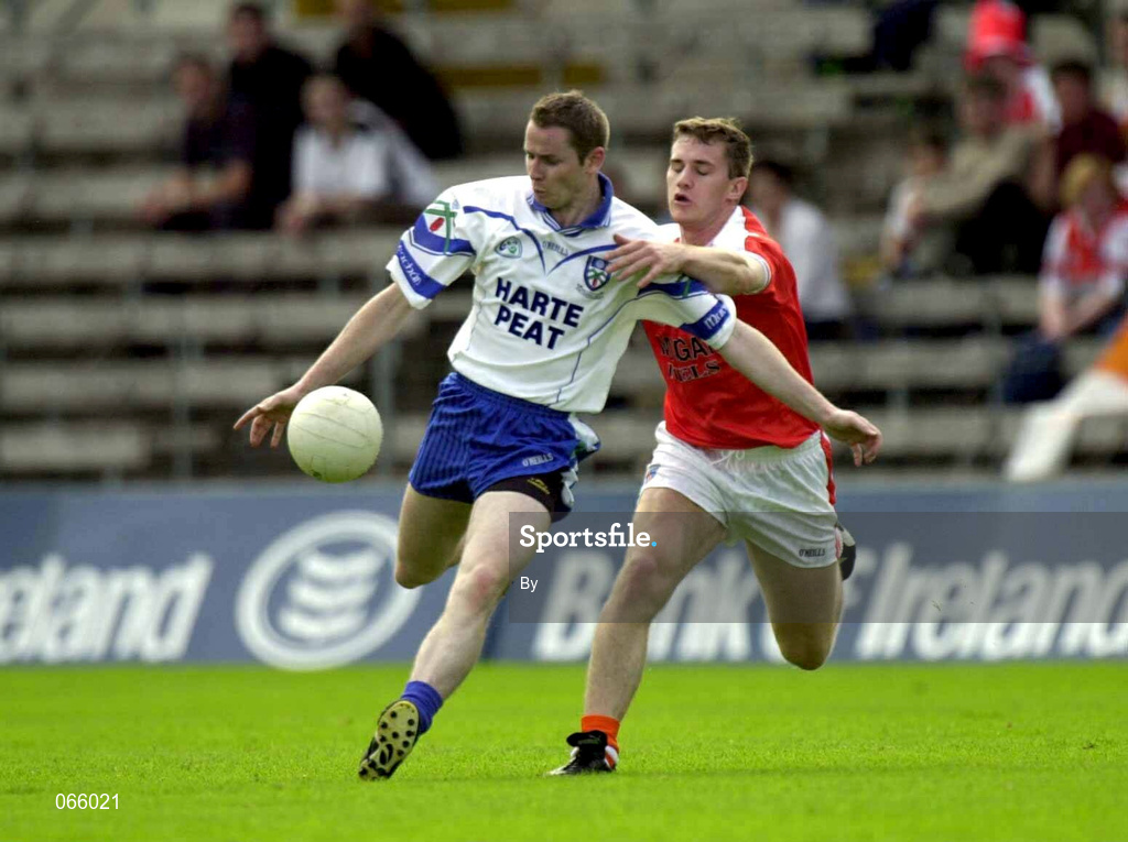 30 June 2001; John Paul Mone, Monaghan, in action against Armagh's John McEntee. Monaghan v Armagh, Bank of Ireland Ulster Senior Football Championship Qualifier, St. Tighearnach's Park, Clones, Co. Monaghan. Picture credit; David Maher / SPORSTFILE *EDI*