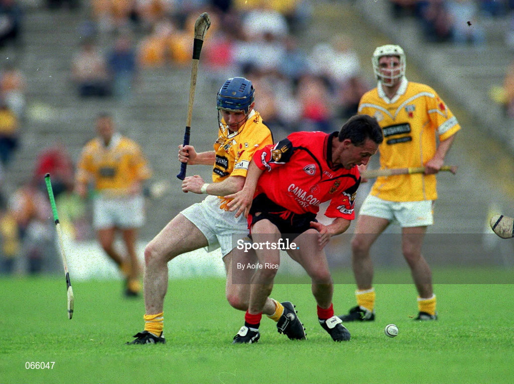 1 July 2001; Martin Coulter Senior of Down is tackled by Conor McCambridge of Antrim during the Bank of Ireland Ulster Senior Football Championship Semi-Final match between Antrim and Down at Casement Park in Belfast. Photo by Aoife Rice/Sportsfile