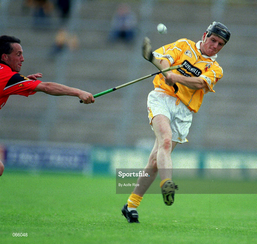 1 July 2001; Aidan Delargey of Antrim is tackled by Martin Coulter Senior of Down during the Bank of Ireland Ulster Senior Football Championship Semi-Final match between Antrim and Down at Casement Park in Belfast. Photo by Aoife Rice/Sportsfile