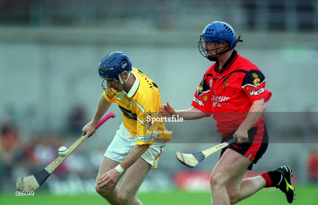 1 July 2001; Conor McCambridge of Antrim is tackled by Gerard Adair of Down during the Bank of Ireland Ulster Senior Football Championship Semi-Final match between Antrim and Down at Casement Park in Belfast. Photo by Aoife Rice/Sportsfile