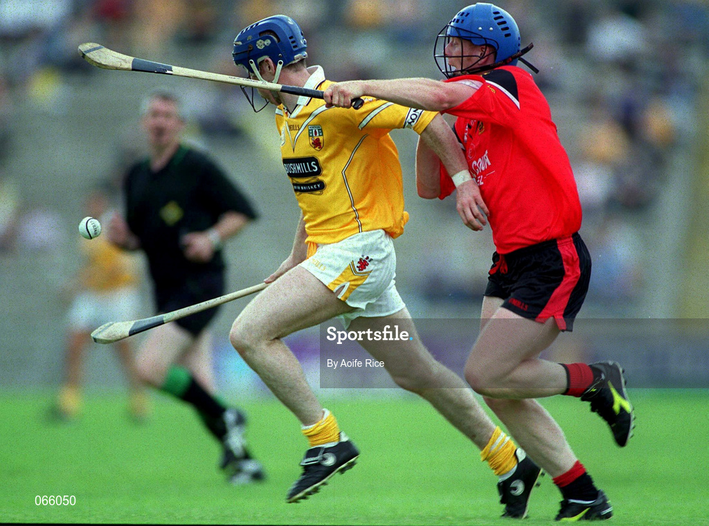 1 July 2001; Conor McCambridge of Antrim is tackled by Gerard Adair of Down during the Bank of Ireland Ulster Senior Football Championship Semi-Final match between Antrim and Down at Casement Park in Belfast. Photo by Aoife Rice/Sportsfile