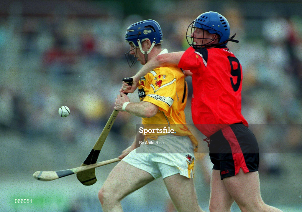 1 July 2001; Conor McCambridge of Antrim is tackled by Gerard Adair of Down during the Bank of Ireland Ulster Senior Football Championship Semi-Final match between Antrim and Down at Casement Park in Belfast. Photo by Aoife Rice/Sportsfile