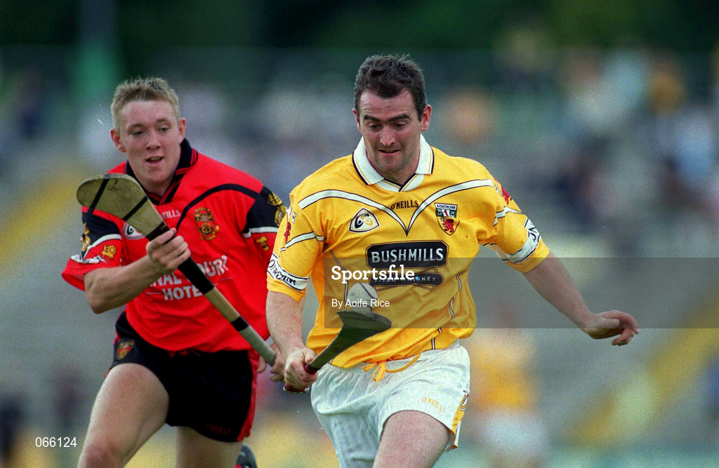 1 July 2001; Alastair Elliot of Antrim is tackled by Jerome Trainor of Down during the Bank of Ireland Ulster Senior Football Championship Semi-Final match between Antrim and Down at Casement Park in Belfast. Photo by Aoife Rice/Sportsfile