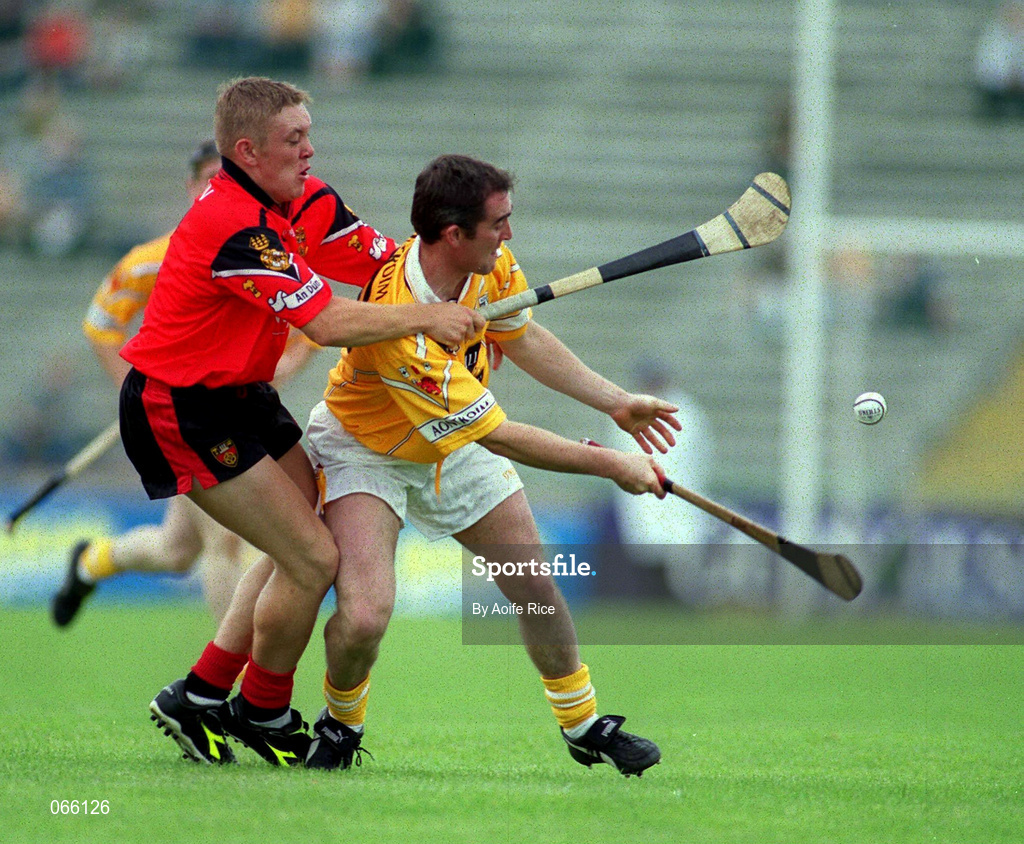 1 July 2001; Alastair Elliot of Antrim is tackled by Jerome Trainor of Down during the Bank of Ireland Ulster Senior Football Championship Semi-Final match between Antrim and Down at Casement Park in Belfast. Photo by Aoife Rice/Sportsfile