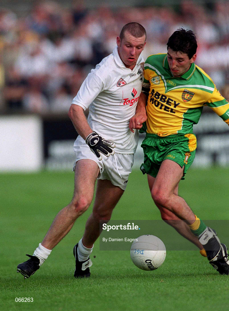 30 June 2001; Ronan Sweeney of Kildare in action against Michael Hegarty of Donegal during the Bank of Ireland All-Ireland Championship Qualifier match between Kildare and Donegal at St Conleths Park in Newbridge, Kildare. Photo by Damien Eagers/Sportsfile