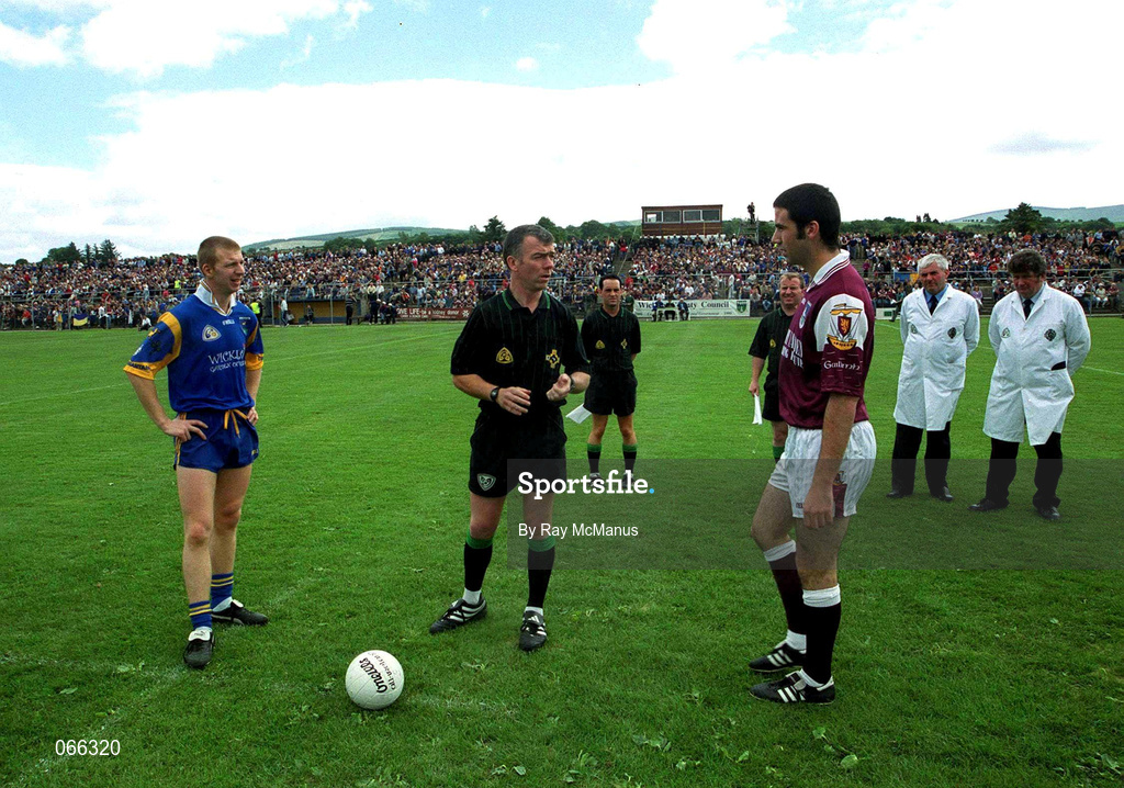 30 June 2001; Galway captain Kieran Comer and Wicklow captain Ronan Coffey pictured with referee Pat McEnaney during the Bank of Ireland All-Ireland Senior Football Championship Qualifier Round 2 match between Wicklow and Galway at Aughrim County Ground in Aughrim, Wicklow. Photo by Ray McManus/Sportsfile