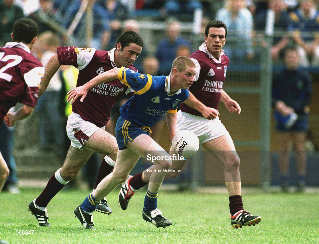 30 June 2001; Stevie Cush of Wicklow in action against Kieran Comer of Galway during the Bank of Ireland All-Ireland Senior Football Championship Qualifier Round 2 match between Wicklow and Galway at Aughrim County Ground in Aughrim, Wicklow. Photo by Ray McManus/Sportsfile