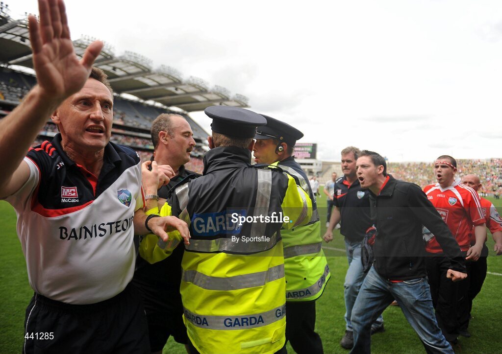 11 July 2010; Louth fans make their views known to referee Martin Sludden as Gardai escort him off the field as Louth manager Peter Fitzpatrick tries to stop Louth fans coming on to the field. Leinster GAA Football Senior Championship Final, Meath v Louth, Croke Park, Dublin. Photo by Sportsfile