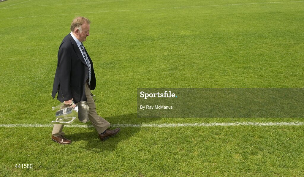 11 July 2010; Munster PRO Jim Forbes walks across the pitch with both the Minor and Senior Cups. Munster GAA Hurling Senior Championship Final, Cork v Waterford, Semple Stadium, Thurles, Co. Tipperary. Picture credit: Ray McManus / SPORTSFILE