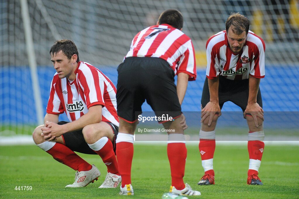 13 July 2010; Sunderland players Daryl Quinn, left, David Healy and Teemu Tainio, right, rest after a strenuous warm-down at half time. Friendly in Aid of Shane Geoghegan Trust, Munster XI v Sunderland AFC, Thomond Park, Limerick. Picture credit: Diarmuid Greene / SPORTSFILE