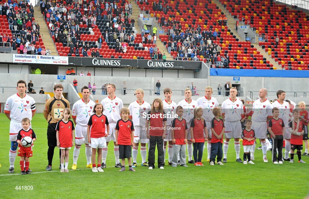 13 July 2010; Munster XI players stand with their mascots before the game. Friendly in Aid of Shane Geoghegan Trust, Munster XI v Sunderland AFC, Thomond Park, Limerick. Picture credit: Diarmuid Greene / SPORTSFILE