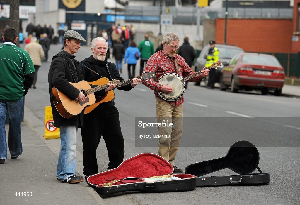 13 March 2010; Buskers play music for supporters as they walk up Jones's Road ahead of the game. RBS Six Nations Rugby Championship, Ireland v Wales, Croke Park, Dublin. Picture credit: Ray McManus / SPORTSFILE